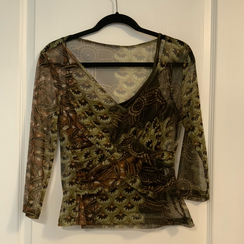 Woman’s rich earth tone, see through top with  matching cami.